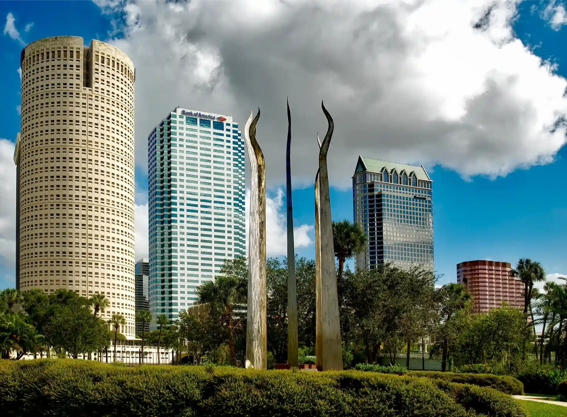 Tampa Florida skyline and modern sculpture representing Merricks Law Group's service area.