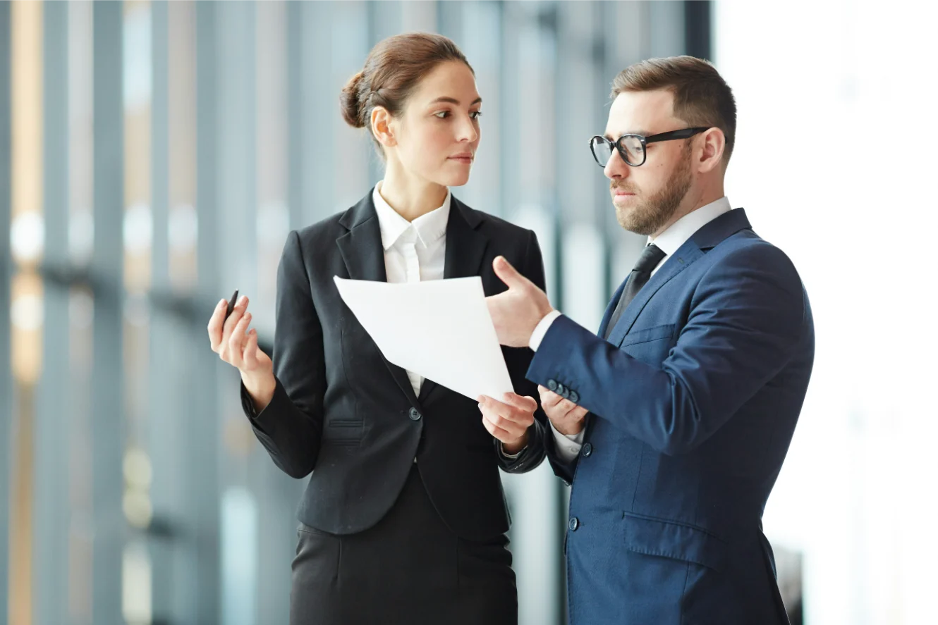 Lawyer and client discussing medical malpractice claim documents.